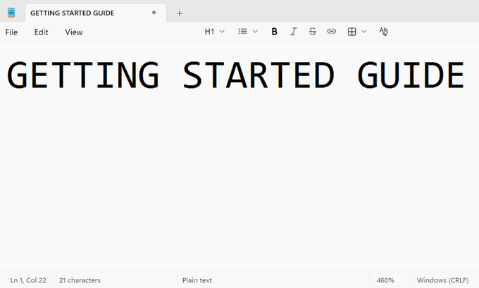 A screenshot of a text editor showing 'GETTING STARTED GUIDE' displayed in large monospaced font.