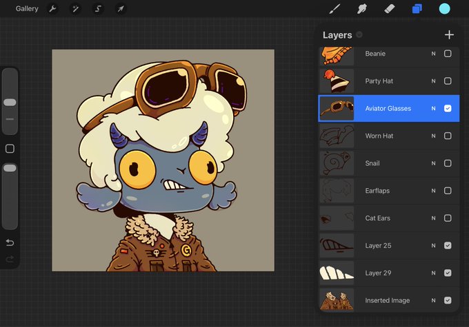 Digital art editing interface displaying a blue cartoon character with aviator glasses, fluffy white hair, and a brown jacket, with a layers panel showing options like Beanie, Party Hat, and Aviator Glasses.