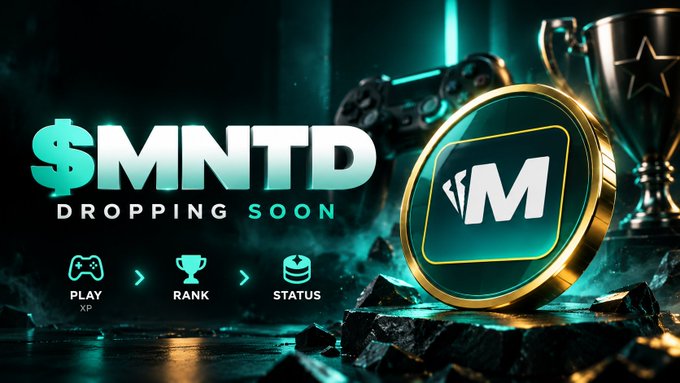 A promotional graphic reading '$MNTD DROPPING SOON' featuring a gold coin with an 'M' logo, gaming controller, and trophy imagery, with icons for 'PLAY XP', 'RANK', and 'STATUS' at the bottom.