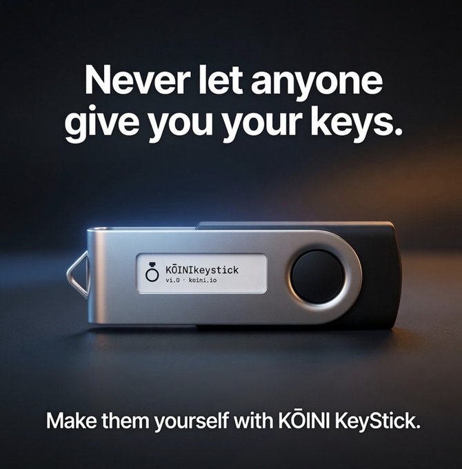 An advertisement for the 'Kōīnī KeyStick' hardware wallet, displaying a sleek silver and black USB-style device on a dark surface with the tagline 'Never let anyone give you your keys. Make them yourself with KŌINĪ KeyStick.'