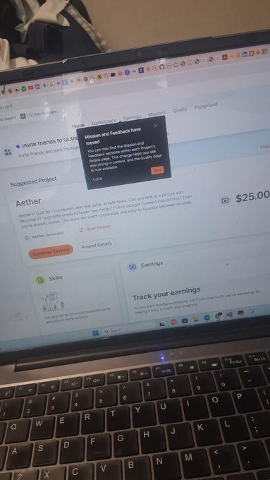 A laptop screen displays the UserTesting platform showing a project titled 'Aether' with a $25.00 payout, while a notification about moved 'Mission and Feedback' tabs appears overlaid.