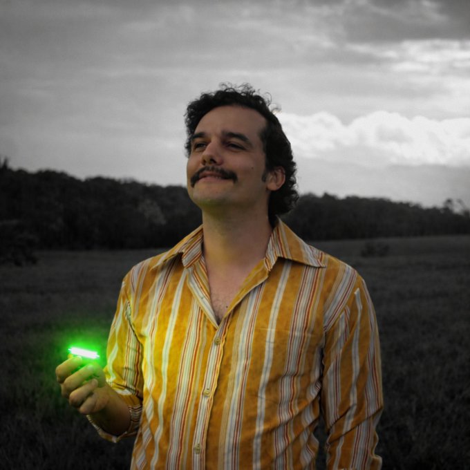A man with a mustache in a yellow striped shirt stands in a field under a cloudy sky, holding a glowing green light with a serene expression. The image's peaceful, triumphant mood mirrors the celebratory tone of the announcement highlighting $PENDLE's substantial buyback milestone, visually suggesting a "green light" moment for the token's growth.