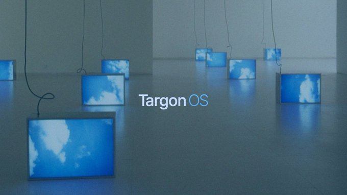 An artistic display showing multiple small monitors with sky cloud imagery arranged on a minimalist floor, featuring the text 'Targon OS' in the center.