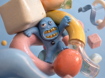 A 3D-rendered scene featuring a small blue creature with golden teeth clinging to a banana, surrounded by floating cereal loops, a glass flask with bubbles, and colorful geometric shapes on a soft blue background.