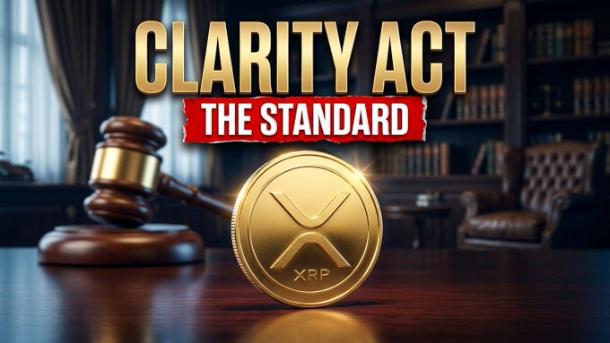 The image features a gold XRP coin resting on a wooden desk beside a judge's gavel, with the text "CLARITY ACT" displayed prominently above a red banner reading "THE STANDARD," visually reinforcing the post's message about XRP's value being driven by its utility and design rather than political theater surrounding the Clarity Act.