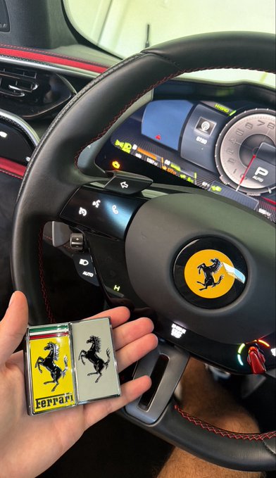 A hand holds a Ferrari-branded lighter next to a Ferrari steering wheel featuring the iconic prancing horse emblem, with the digital dashboard displaying 70 and Italian flag colors, celebrating a $1.5 SOL milestone in classic supercar luxury style.