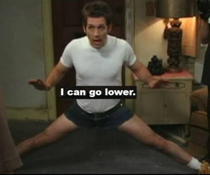 A screenshot from the TV show It's Always Sunny in Philadelphia showing the character Dennis squatting with arms out, overlaid with the text 'I can go lower.'