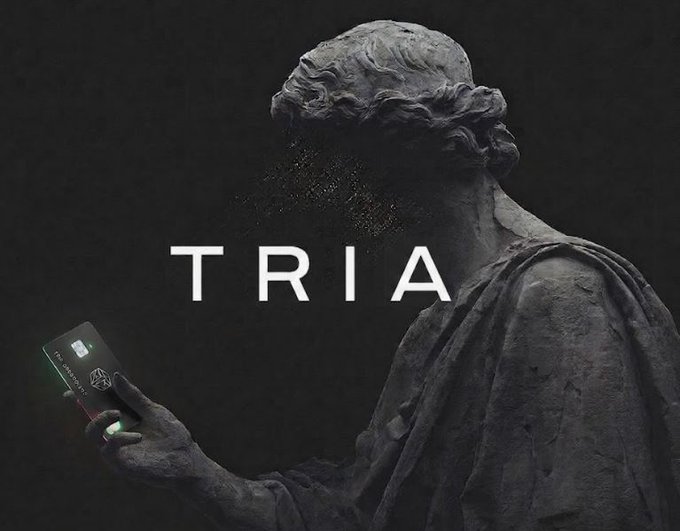 The image features an advertisement for a credit card company named @useTria. The main subject of the image is a statue holding a cell phone up against a black background. The text "Tria" can be seen, which is likely the name or logo of the credit card company. The image also includes a caption that reads: "There's something I've really noticed. The more I learn about @useTria, the less I need to compare it to other platforms. You earn as you spend, and the community is also motivated through incentives."