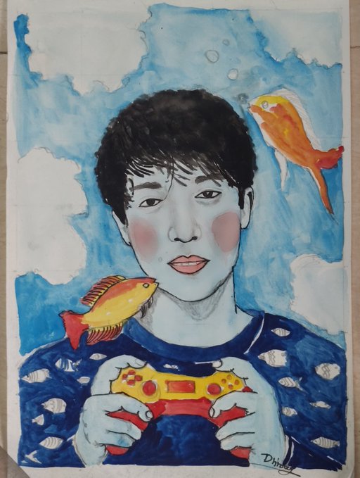 A watercolor painting of a young person with dark hair and pink cheeks holding a red and yellow game controller, wearing a blue sweater with fish patterns, with two orange and yellow fish swimming in a blue sky background; signed 'Dhata' in the corner.