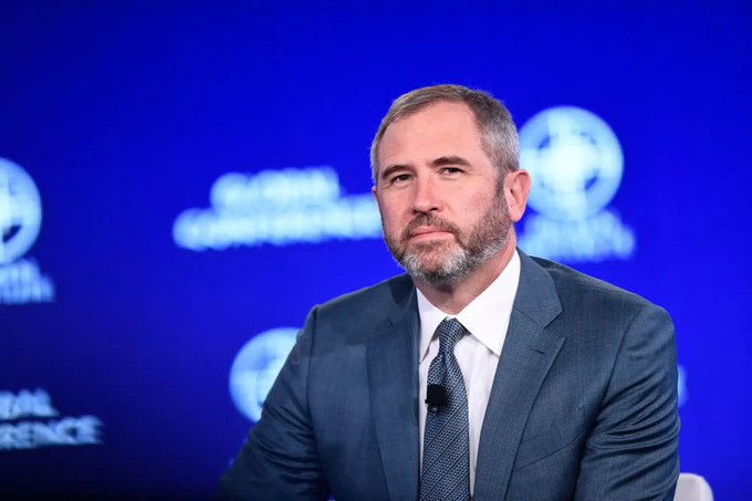 Brad Garlinghouse, CEO of Ripple, appears at a Global Financial Leadership Conference panel, with the post highlighting Ripple's involvement in a historic milestone tied to XRP and a $10,000 reference.