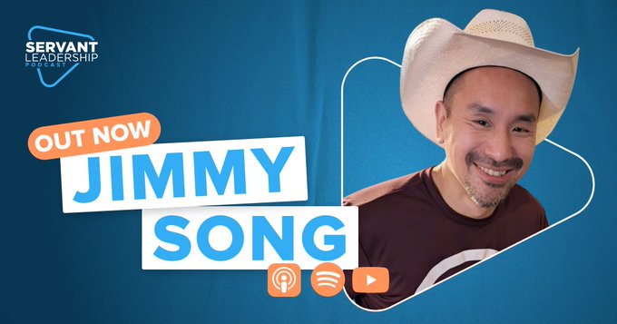 The image features a man wearing a cowboy hat, smiling at the camera while holding a microphone. The background of the image has a blue color with white text that reads "Out Now Jimmy Song" along with other details about the content on the screen.