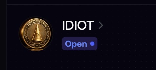 A digital interface displays a gold coin labeled 'IDIOT COIN' alongside the text 'IDIOT' and an 'Open' button on a dark background.