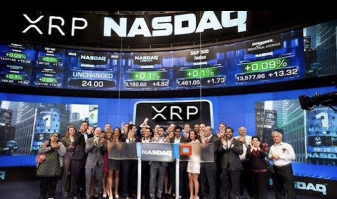 A large group of people celebrating at the NASDAQ stock exchange, standing under a digital ticker with 'XRP' prominently displayed.