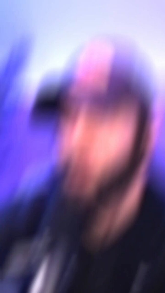 The image features a blurry photo of a person wearing a hat, possibly a baseball cap or a sun hat. The background appears to be a dark blue color with some purple elements. The caption "Well....looks like Trizzey is not 0.25 to 6.836 SOL". This means that the focus on the image was intentionally made blurry for artistic purposes, creating an interesting and unique effect.