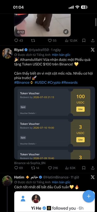 A screenshot of a tweet by @riyadrafi50 showing token vouchers from Binance, including 100 USDC and 3 USDC vouchers redeemable by 2026, accompanying a post claiming to have received $100 from Binance as a loyal customer reward.