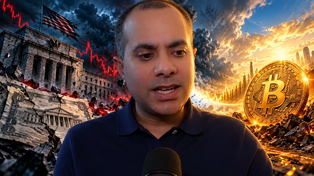 a man speaking into a microphone with a dramatic background featuring a crumbling U.S. Treasury building, declining red stock charts, a tattered American flag, and a large gold Bitcoin coin