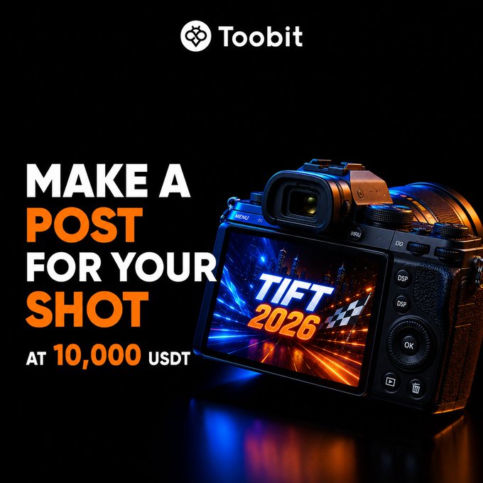 A promotional graphic for Toobit cryptocurrency exchange advertising a 'TIFT 2026' photo contest where users can 'MAKE A POST FOR YOUR SHOT' and win up to 10,000 USDT, featuring a DSLR camera with a racing-themed display on its screen.