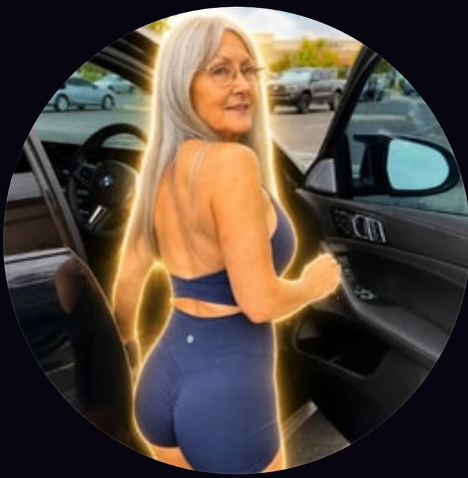 A stylized image with a yellow glow effect shows a woman with long silver hair wearing a blue sports bra and shorts, standing beside an open car door in a parking lot.