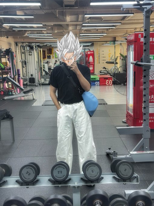 A gym-goer stands among rows of 25-pound dumbbells, wearing a black shirt and white pants with a blue crossbody bag, while their face is humorously replaced with an anime character's spiky-haired visage — fitting the post's daily fitness check-in (#day21 back day + 40 min cardio) and meme-style crypto endorsement of $Bns.