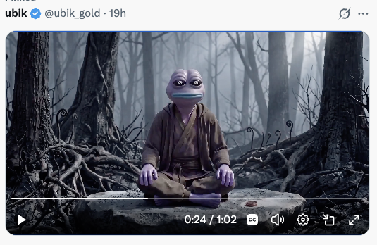 A screenshot of a video posted by user 'ubik @ubik_gold' showing a purple-skinned alien-like character with large eyes meditating in brown robes on a stone platform in a misty, spooky forest.