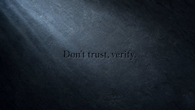 A dark, textured stone-like background featuring the engraved text "Don't trust, verify." in the center, paired with a Bitcoin ₿ symbol. The image aligns with the caption's message of verification in the crypto space, serving as a sleek minimalist Bitcoin-themed wallpaper.
