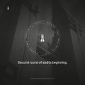 A very dark, low-resolution image showing a person inside a glowing circle with the partially legible text 'Sacred sound of bells beginning'.