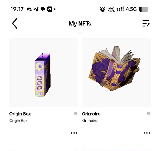 A screenshot of a mobile app showing 'My NFTs' collection with two items: an 'Origin Box' (a purple and gold box) and a 'Grimoire' (an open book with a magical design).