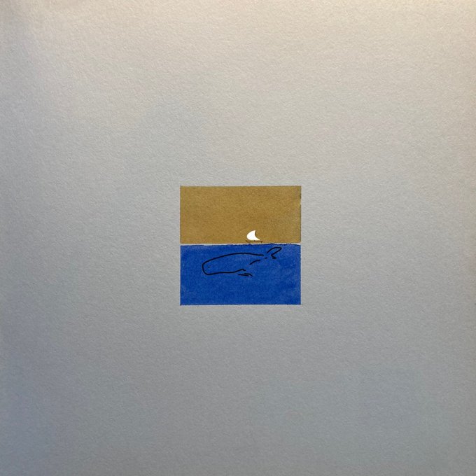 A simple drawing on gray paper depicts a tan rectangle above a blue rectangle with a small white crescent moon and a squiggly line.