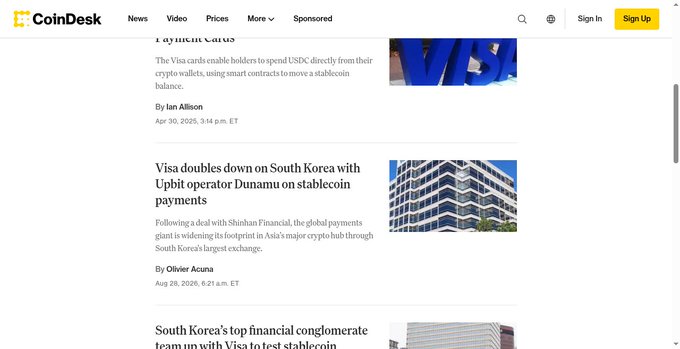 A screenshot of the CoinDesk news website showing articles about Visa enabling stablecoin payments via crypto wallets and partnering with South Korea's Dunamu on stablecoin operations.