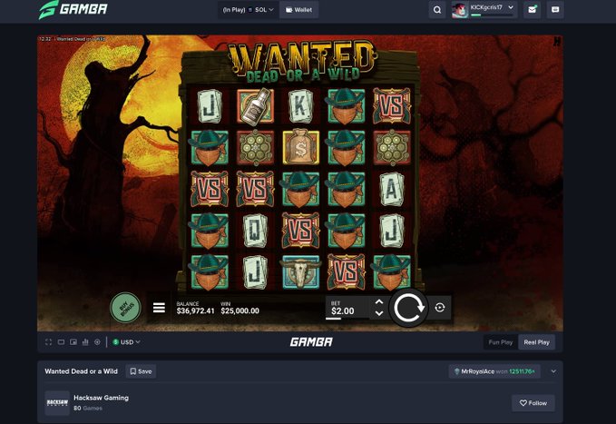 The image shows a screenshot of an online slot game called "Wanted Dead or a Wild" by Hacksaw Gaming on the Gamba platform, displaying a balance of $36,572.41 and a win of $25,000.00. This visual confirms the user's celebration of a $25,000 max win during their stream, capturing the exact moment of the big payout on the slot machine.