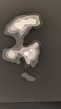 An abstract artwork featuring layered, organic shapes in muted brown and beige tones against a dark background, with varying opacities creating depth.