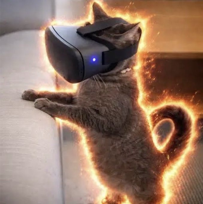 A gray cat wearing a black VR headset lies on its back on a light-colored couch, with fiery orange flames edited around its body, creating a humorous "fire cat" or gaming warrior effect. The image plays on the post's meme-like, hyped tone about crypto/stock trading gains, visually suggesting the user is so dialed into their virtual trading world that they're "blazing" with profits while lounging—a tongue-in-cheek nod to the idea of effortlessly earning from holding these "stock pairs" allocations.