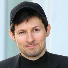 A man with short brown hair and a light beard, wearing a black baseball cap and a black turtleneck, smiles faintly at the camera. The image corresponds to the post, which features Telegram CEO Pavel Durov announcing the readiness of the Gram Wallet and its upcoming rollout to Telegram's vast user base.