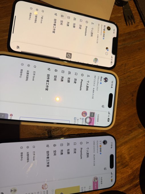 Three iPhones are arranged on a wooden table, each displaying the Binance app in Chinese, showing interface elements like "个人资料" (Personal Info), "Premium," and various navigation icons. The image appears to capture a moment of collaboration or recognition involving Binance, aligning with the post's tone of gratitude toward "Teacher Bear" and highlighting the importance of communication and respect in the relationship.