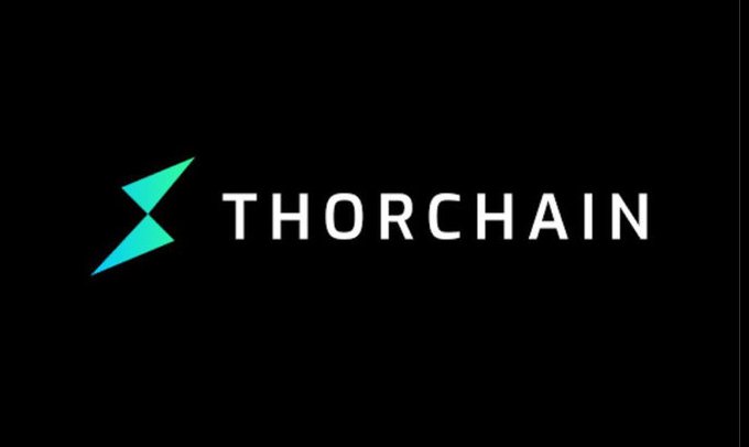 The image features an advertisement for ThorChain, a company that specializes in blockchain technology. The advertisement displays the name of the company in white letters against a black background. There's also text within the logo reading "THORCHAIN". This logo represents the core of the company and its services. In addition to this branding aspect, there is an image depicting two upward-pointing blue triangles with a lightning bolt symbol between them. This design element adds visual interest and reinforces the sense that ThorChain provides secure solutions for blockchain networks. The overall layout suggests the advertisement may be related to a post on social media or other online platforms.