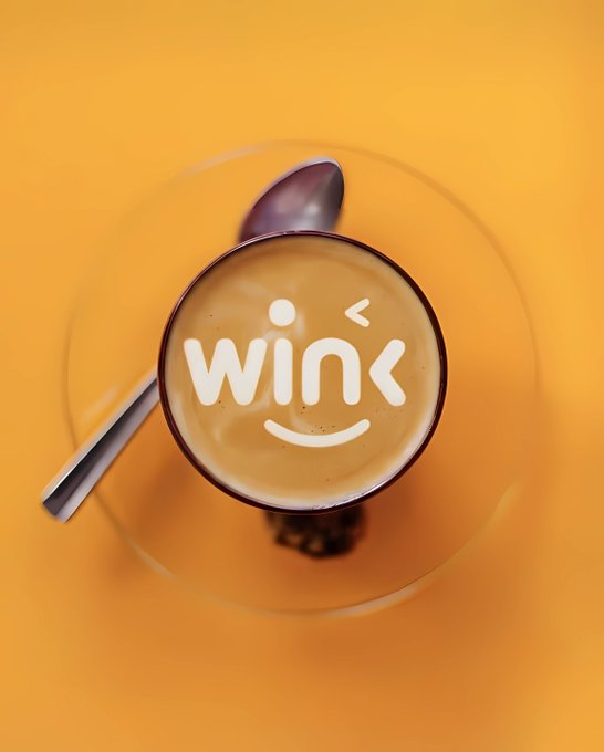 A top-down view of a cappuccino with 'wink' latte art featuring a smiley face, set against an orange background.
