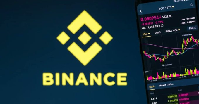 The Binance logo alongside a smartphone displaying the "BCC/BTC" trading pair at 0.080954, symbolizing the crypto exchange under European regulatory scrutiny for allegedly misusing "reverse solicitation" rules to continue serving EU customers without proper MiCA licensing.