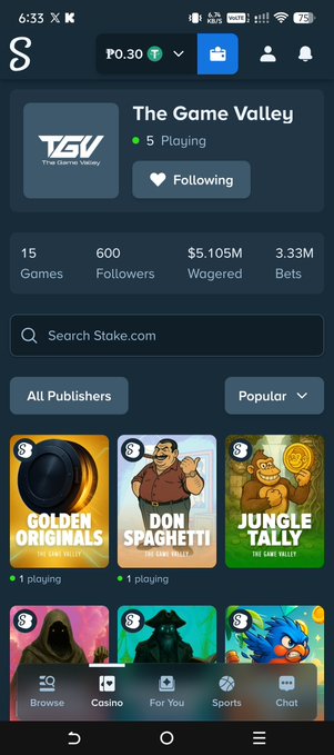 A mobile screenshot of the Stake.com app showing 'The Game Valley' publisher profile with 5 playing, 600 followers, $5.105M wagered, and game thumbnails for Golden Originals, Don Spaghetti, and Jungle Tally.