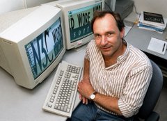 A man sits at a desk smiling beside two CRT monitors displaying time and date information, alongside an old keyboard. The image is a nostalgic nod to early tech infrastructure, symbolically tying the post's message about $XRP being well-positioned for the future of tokenization and digital payment rails, suggesting the cryptocurrency is the modern evolution of the foundational technology shown.