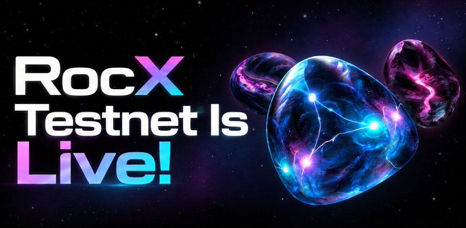 The image is a promotional graphic with a cosmic, futuristic aesthetic that reads "RocX Testnet Is Live!" in bold gradient text alongside glowing purple and blue celestial spheres, announcing the launch of the RocX testnet as referenced in the airdrop details.