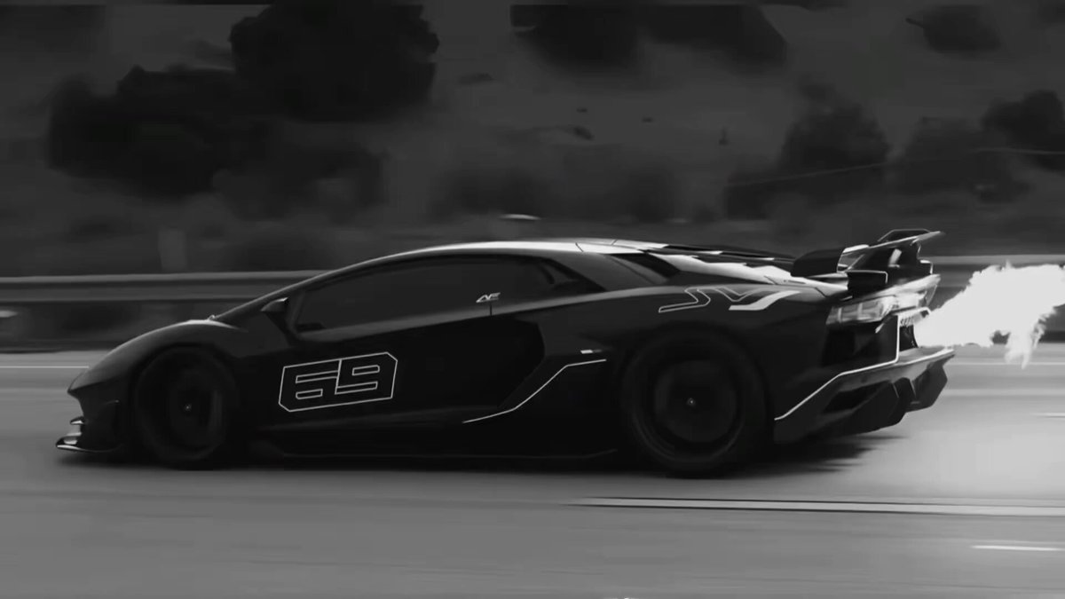 The image features a black sports car with the number "9" on its side, driving down a road under a cloudy sky. There are also some clouds visible in the background. The caption of the image reads "solana is the motion chain". This phrase refers to the motion chain used by the sports car, which is likely an engine-driven system that provides instant acceleration and power when needed.