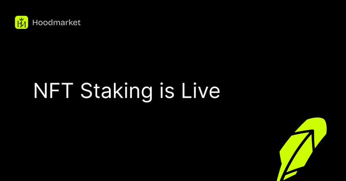 The image is a black promotional graphic for HoodMarket featuring a yellow-green logo in the top-left corner and a feather quill illustration in the bottom-right, with the bold white headline "NFT Staking is Live" centered to announce the platform's newly launched feature that allows collection owners to create custom staking reward programs directly without separate contracts.