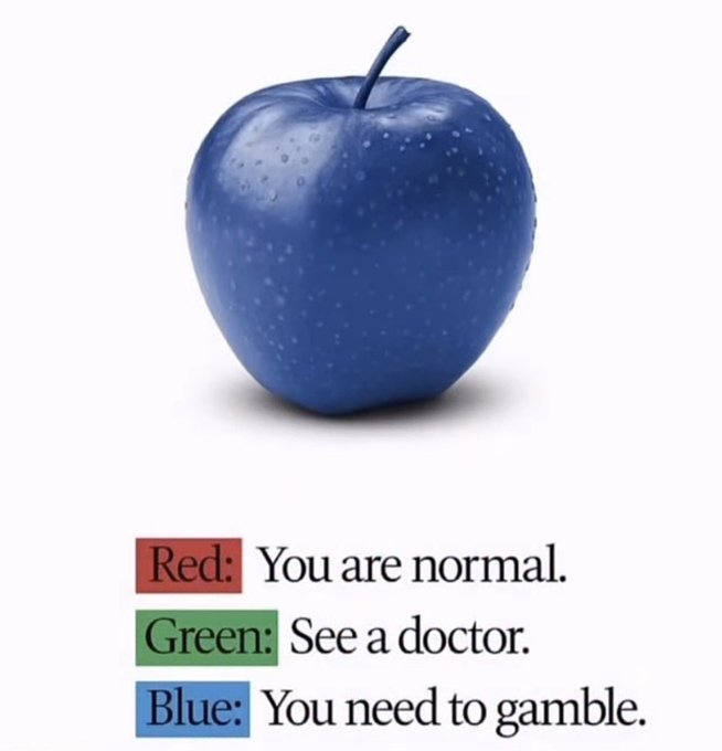 A blue apple with water droplets on a white background, with text below reading 'Red: You are normal.', 'Green: See a doctor.', and 'Blue: You need to gamble.'