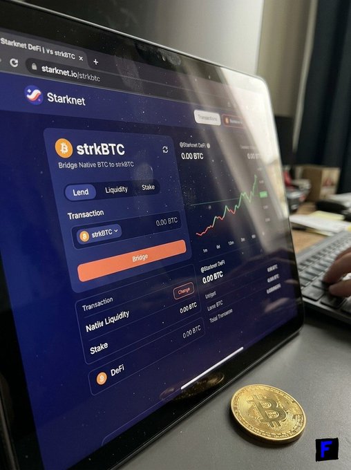 A laptop displays the Starknet DeFi interface showing the strkBTC bridging page (starknet.io/strkbtc) with options to Lend, provide Liquidity, or Stake BTC, while a physical Bitcoin commemorative coin rests beside the screen. The image visually reinforces the post's point about bridging native BTC into Starknet's DeFi ecosystem rather than leaving it idle.