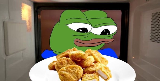 A Pepe the Frog meme image shows the character inside a microwave behind a plate piled high with breaded chicken nuggets.