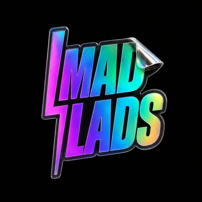 A holographic, rainbow-colored 'MAD LADS' logo sticker against a black background.