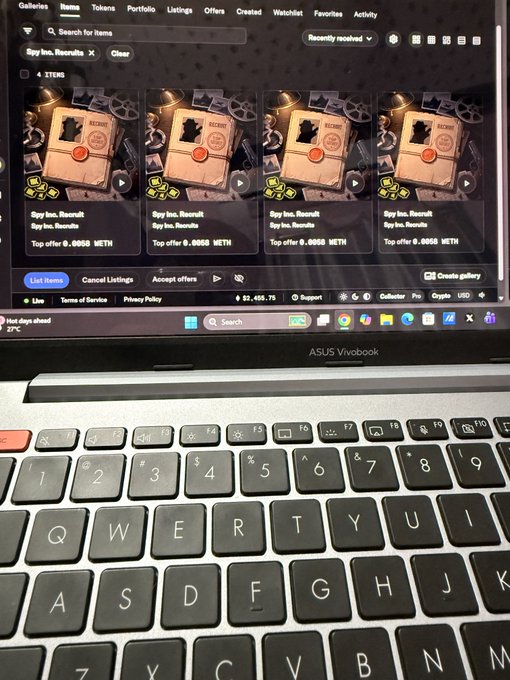 A laptop displays an NFT marketplace showing four listings for "Spy Inc. Results" items, each with a top offer of 0.0055 ETH. The image ties to the post by showcasing the actual collection purchase of Spy Inc. NFTs on what appears to be a marketplace, reflecting the user's excitement about diving into this growing crypto gaming ecosystem.