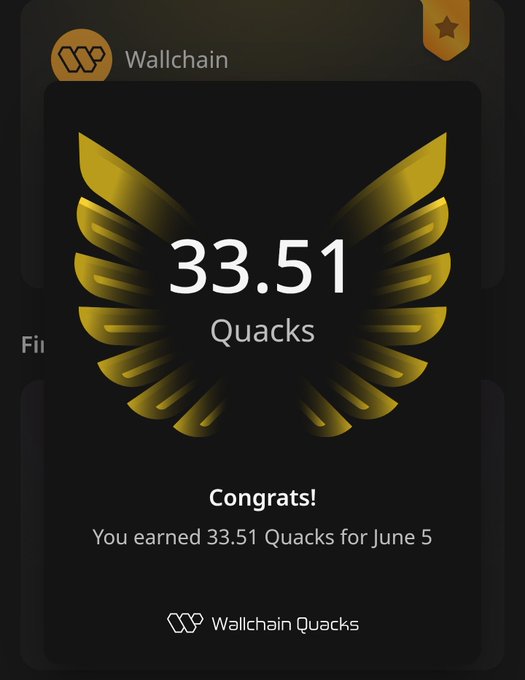 In the image, there's a sign containing congratulations from @wallchain for the Quacks. The main focus of the image is the logo and the text that accompanies it.