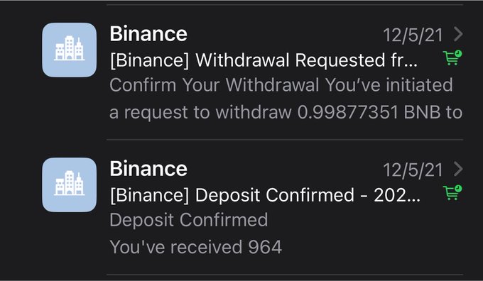 A smartphone screen displays two Binance notifications dated 12/5/21: a withdrawal request confirmation for 0.99877351 BNB and a deposit confirmation of 964.