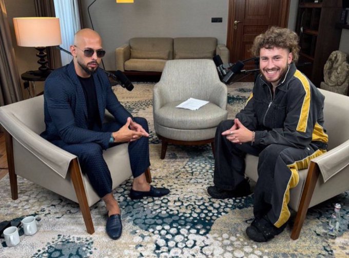 Two men sit facing each other in armchairs during what appears to be a podcast recording, with microphones positioned between them. The relaxed, well-lit setting and casual attire of both guests suggest a friendly discussion likely centered around cryptocurrency topics, aligning with the post's optimistic "Sol to $500" price prediction for Solana.